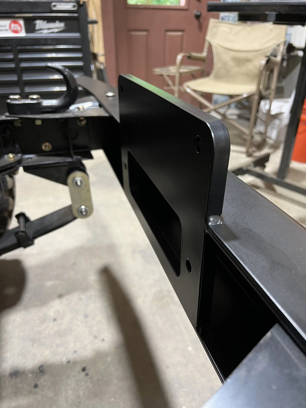 OP Machine and Fabrication Toyota Land Cruiser FJ40  front bumper mounted on vehicle frame
